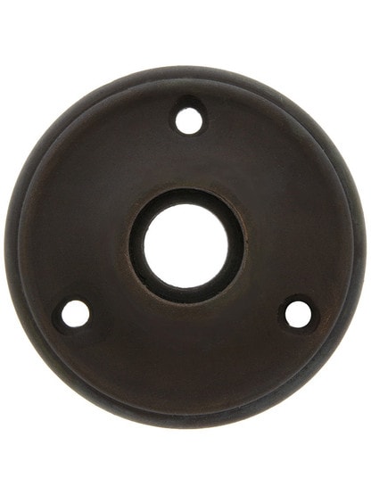 2 1/4 inch Cast Brass Rosette With 21/32 inch Collar in Oil Rubbed Bronze.